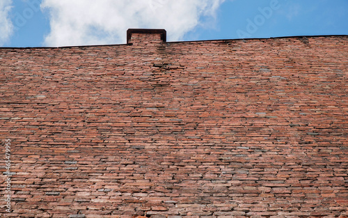 red brick wall with sky pipe