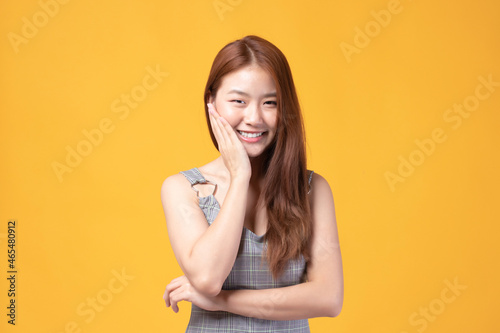 Portrait of beautiful young Asian girl model long hair in casual summer clothes smile, happy and enjoying in studio isolated on white background.