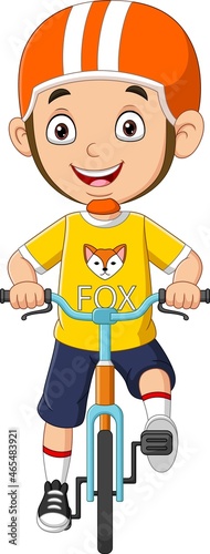 Cute little boy riding bicycle