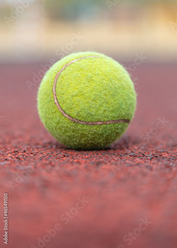 Tennis ball on the court. © schankz