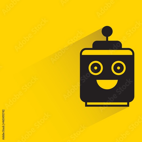 robot head with drop shadow on yellow background