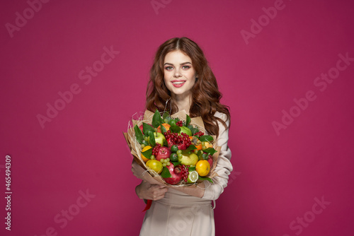 portrait of a woman smile posing fresh fruits bouquet emotions isolated background