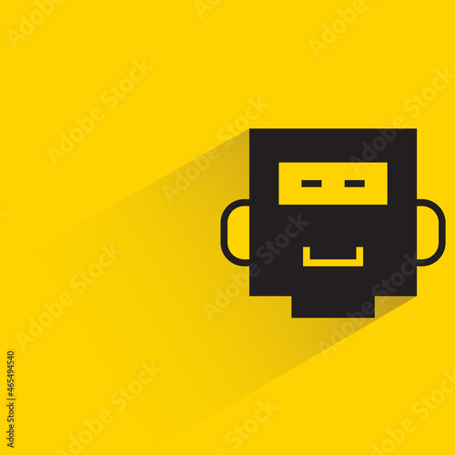 robot head with drop shadow on yellow background
