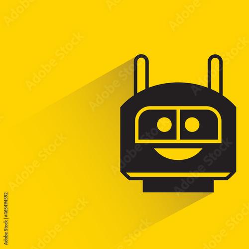 robot head with drop shadow on yellow background