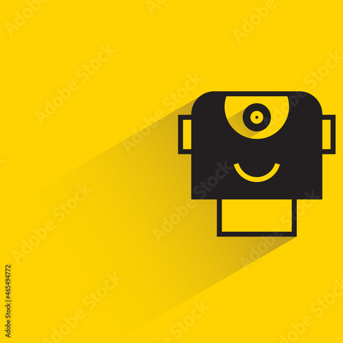 robot head with drop shadow on yellow background
