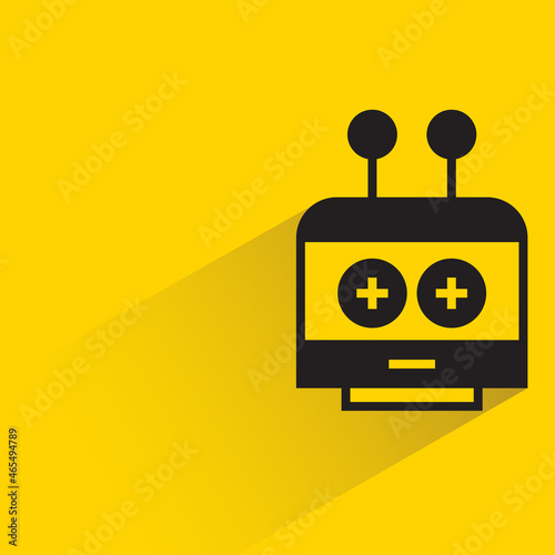 robot head with drop shadow on yellow background