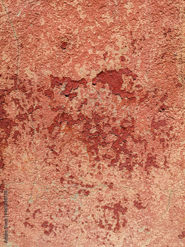 Old red plaster on the wall.