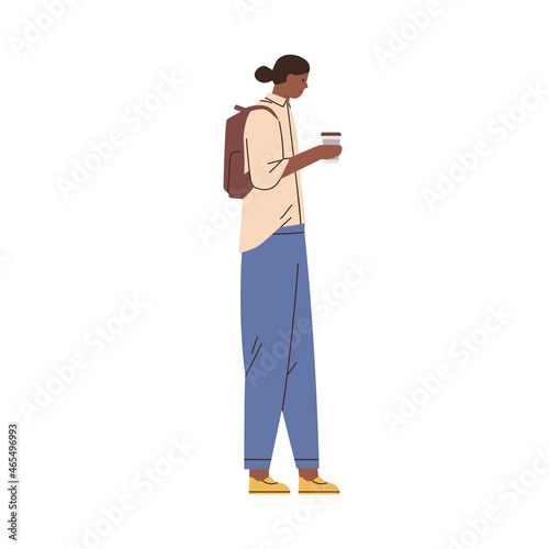 Black man walking with coffee cup in hand. African-American student going wit...
