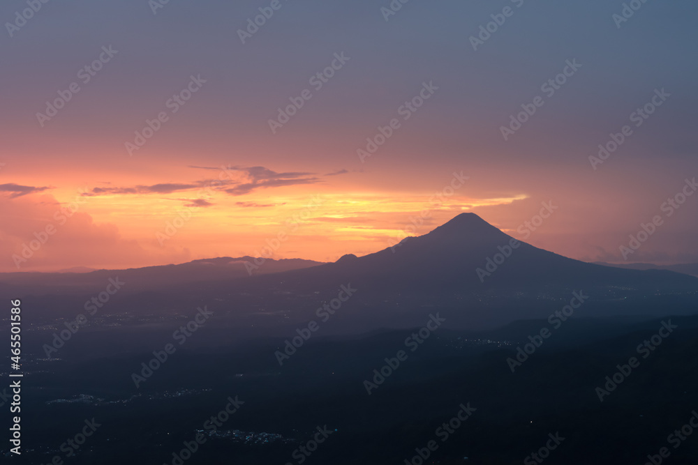 close-up photo of the mountain with red clouds