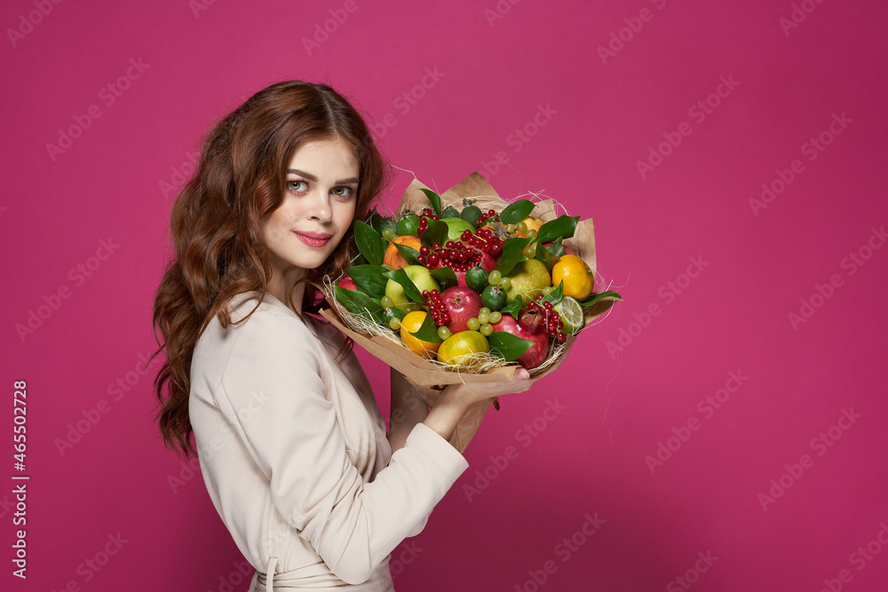 pretty woman bright makeup attractive look a bouquet of fruits pink background pretty woman bright makeup attractive look a bouquet of fruits pink background