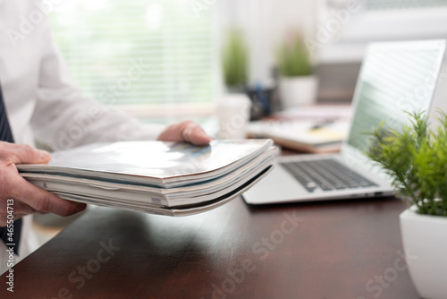 Man holding magazines