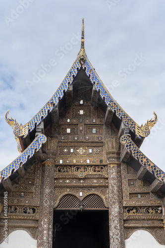 View of the beautiful wooden gable of ancient Lanna style vihara inside compound of historic Wat Prasat buddhist temple, Chiang Mai, Thailand
