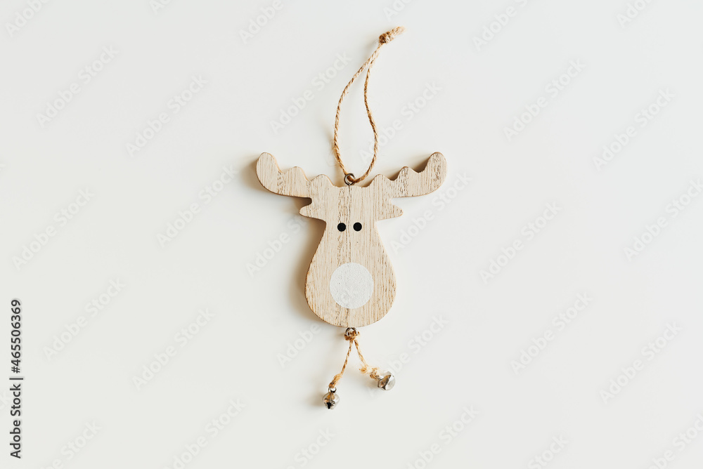 One wooden deer shaped Christmas ornament on white background, top view. Eco friendly handmade Christmas decor One wooden deer shaped Christmas ornament on white background, top view. Eco friendly handmade Christmas decor