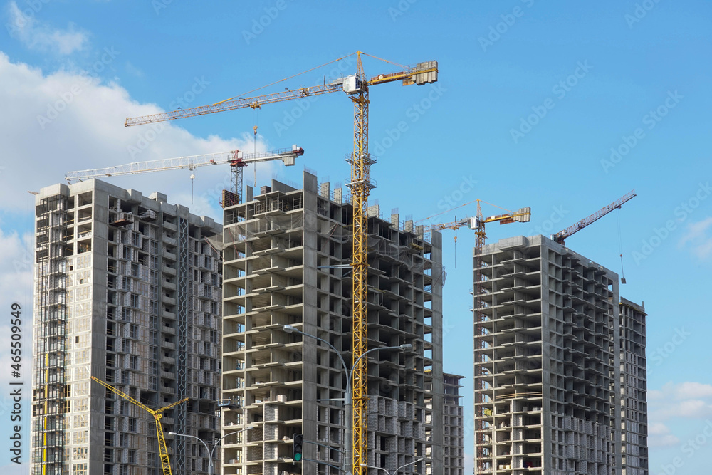 Photo of the construction of a multi-storey buildings and houses