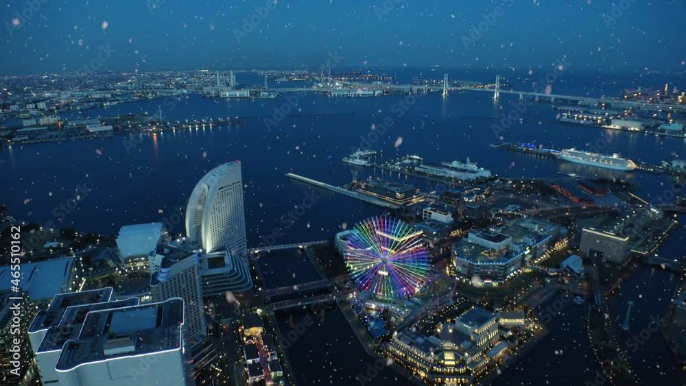 SAKURAGICHO, YOKOHAMA, JAPAN : Aerial view of cityscape of Yokohama and snow. View around Minato mirai (harbor, port, sea) area. Japanese winter and romantic Christmas concept. Night time shot.