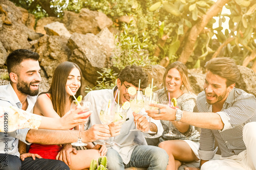 Photography Friends having fun and drinking mocktails, group of friends hanging out and toasting non alcoholic drinks outdoors