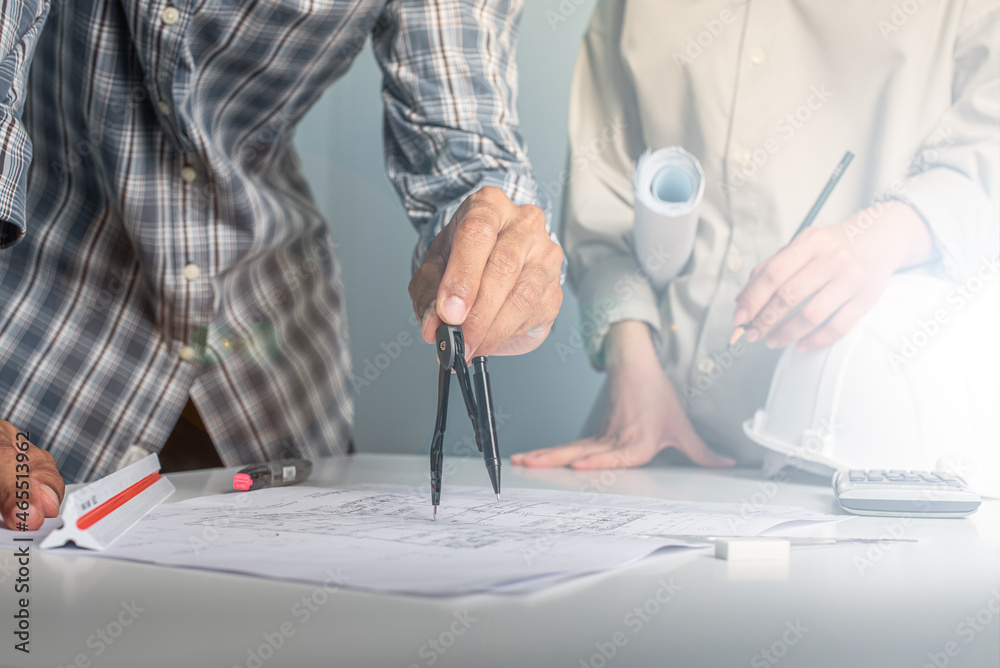 Architect working on blueprint. Architects workplace - architectural ...