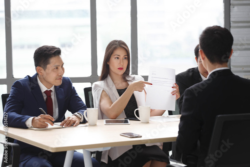group of business people in suits and Human resources manager female interviewing new worker or employee . serious interviewer woman in job interview © iammotos