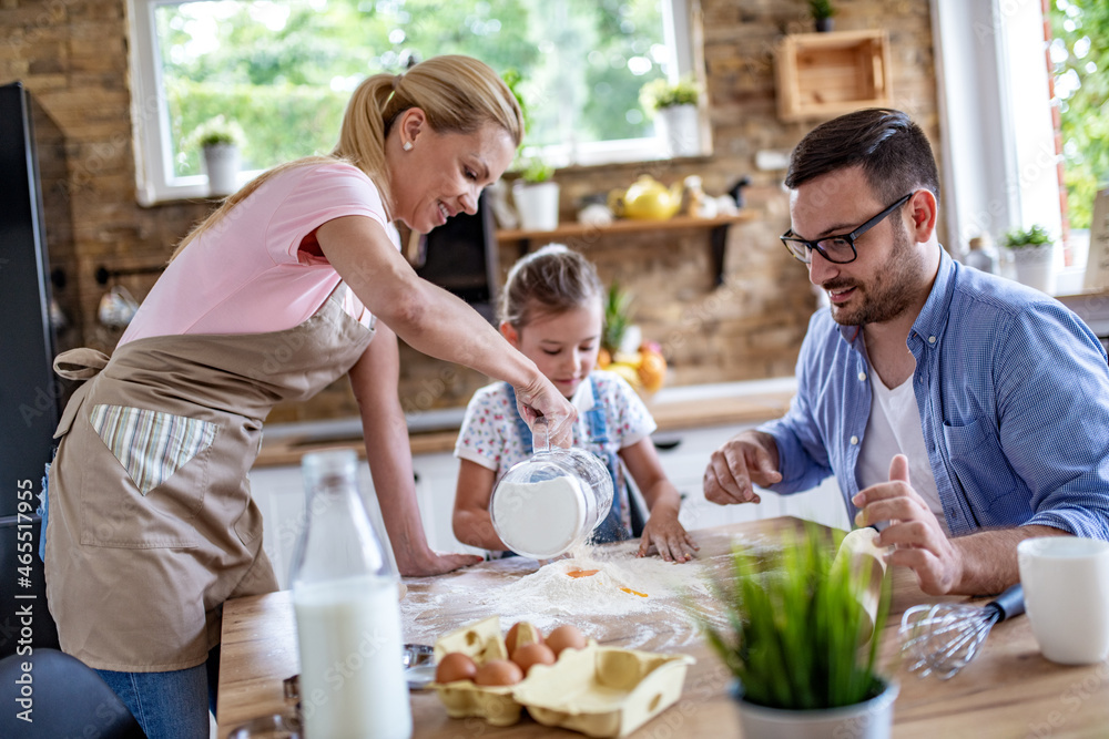 Family make a cookie in the kitchen Family make a cookie in the kitchen