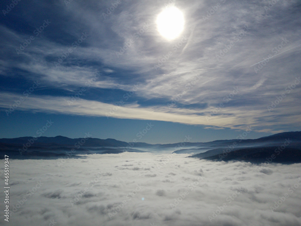 sunrise over the mountains, flying over fog, fog over small town, sun and mountains