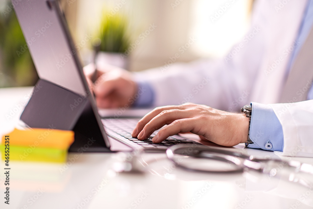 Fototapeta premium Doctor working on laptop