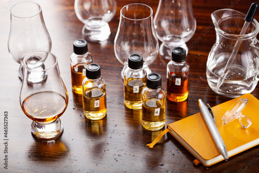 tasting bottles and glasses of whisky spirit brandy cognac. tasting at home