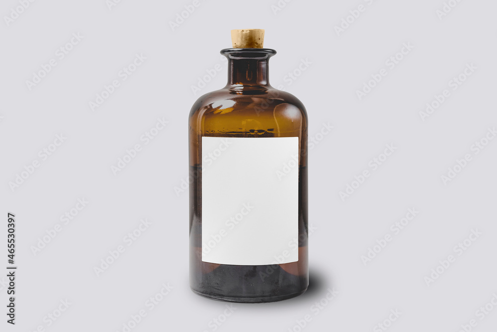 Transparent glass bottle with plug Mock up isolated on a grey background. 3d rendering. Transparent glass bottle with plug Mock up isolated on a grey background. 3d rendering.