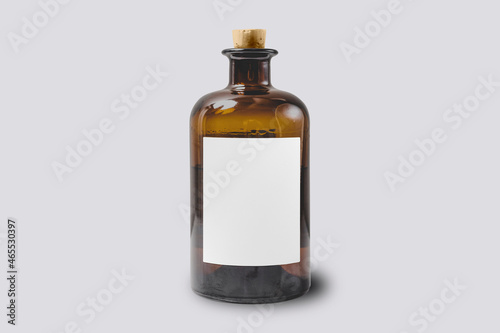 Transparent glass bottle with plug Mock up isolated on a grey background. 3d rendering.