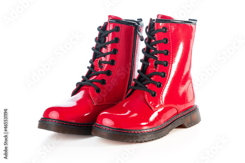 Red leather shoes. Shining boots isolated on white background