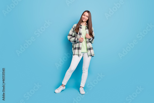 Full length photo of young attractive girl happy positive smile wear casual outfit isolated over blue color background