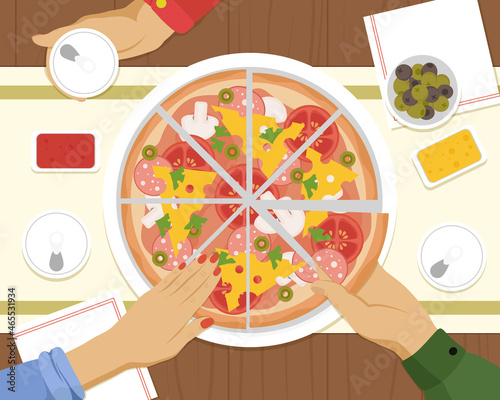 People having dinner together and sharing a huge pizza with drinks, hands top view. Friends dinner with pizza.