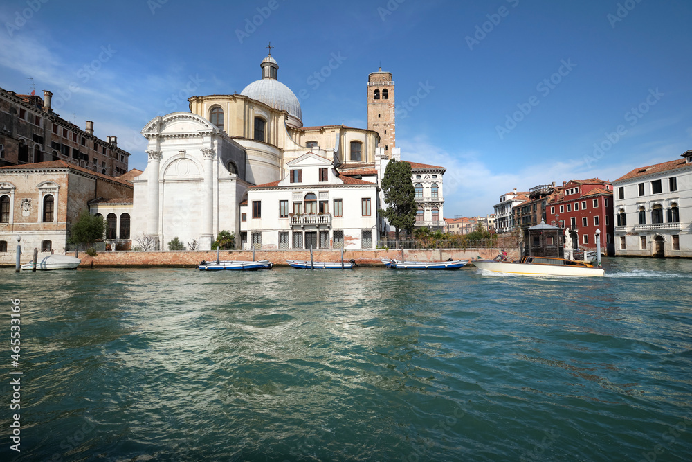 Venice, Grand Canal. Sr Geremia church or Chiesa di San Geremia reflected in blue green sea water. Historic Venetian church.