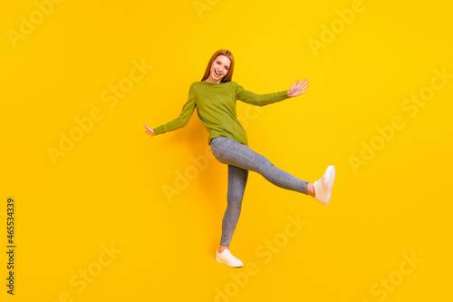 Full length body size photo dancing in casual clothes girl at party isolated vibrant yellow color background