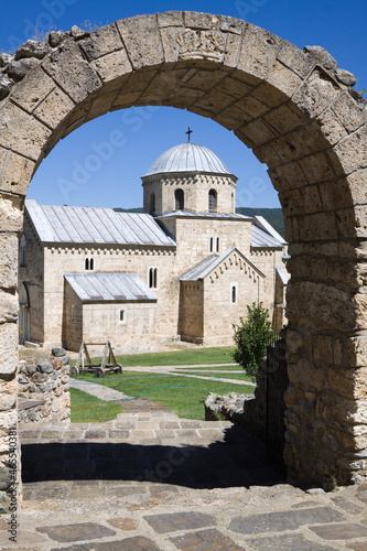 The church of the Gradac monastery is visible through the arch