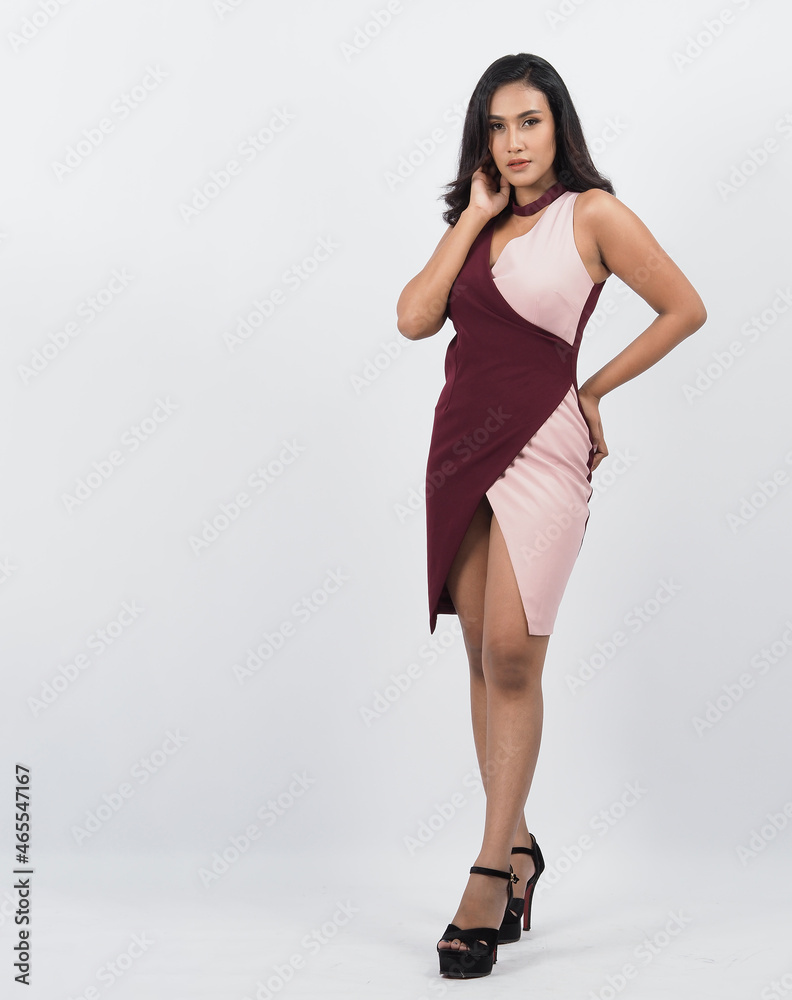 Asian woman full body. Thai woman in a modern chic style stands in white studio with elegant and confident pose. Casting model supporting actor actress. Asian woman fullbody pose in front of camera.