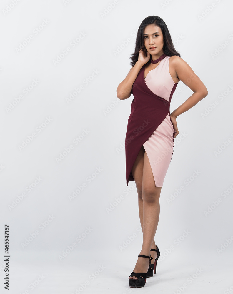 Asian woman full body. Thai woman in a modern chic style stands in white studio with elegant and confident pose. Casting model supporting actor actress. Asian woman fullbody pose in front of camera. Asian woman full body. Thai woman in a modern chic style stands in white studio with elegant and confident pose. Casting model supporting actor actress. Asian woman fullbody pose in front of camera.