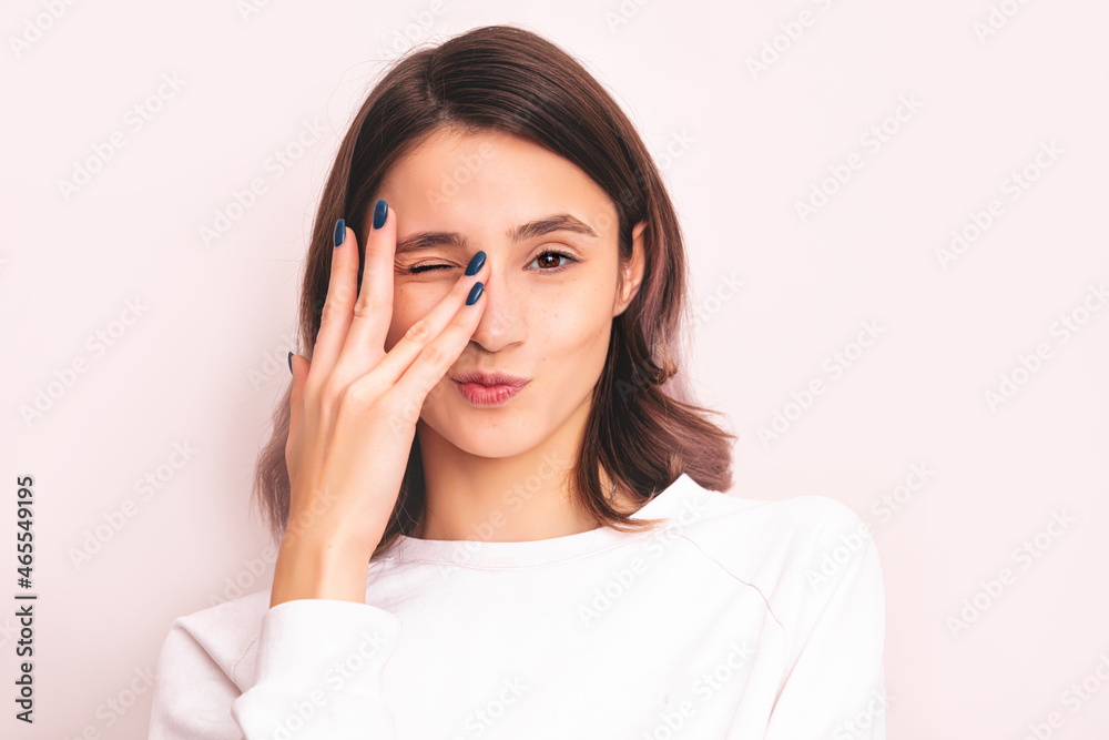 Portrait of a young girl model beautiful and natural with emotions in the studio Portrait of a young girl model beautiful and natural with emotions in the studio