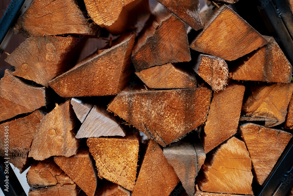 Side view of stacked wood logs for a background Side view of stacked wood logs for a background