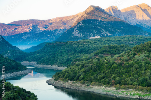 Obraz na płótnie Stunning view of the Cedrino Lake (Lago del Cedrino) with the mountain range of Supramonte illuminated by a beautiful sunrise. Sardinia, Italy. w salonie