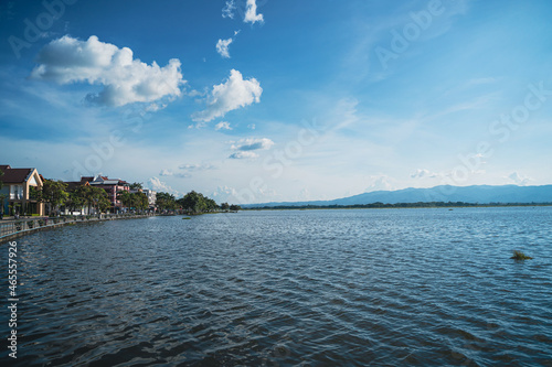 Fototapeta Naklejka Na Ścianę i Meble -  Lakeside view of the Phayao lake in Thailand. Landscape of the lake with buildings on the lakeside. 