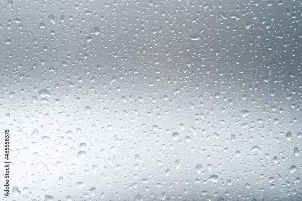 Rain drops and dew. water drops on a gray car roof after stopped raining , selective focus waterproof surface. soft focus. Leave space for writing text background.