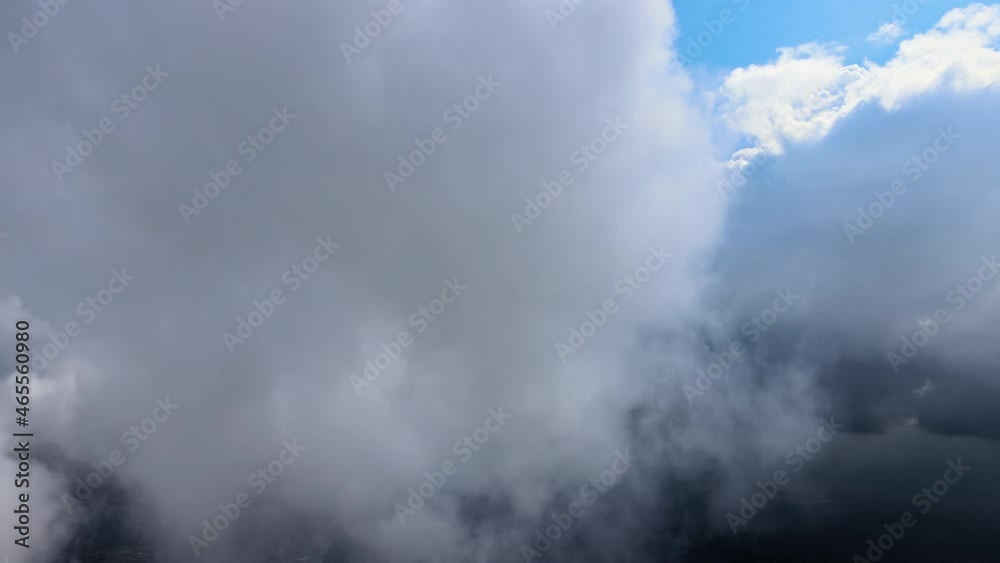 Aerial view from airplane window at high altitude of earth covered with puffy cumulus clouds forming before rainstorm. Aerial view from airplane window at high altitude of earth covered with puffy cumulus clouds forming before rainstorm.