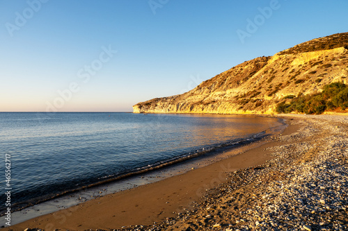 Sandy beach and calm sea against the backdrop of rocks. Pissouri village, between Limassol and Paphos, Cyprus. photo