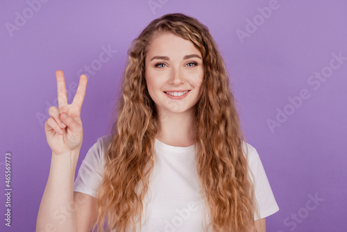 Photo of cute pretty friendly lady show show v-sign symbol wear casual outfit on violet background