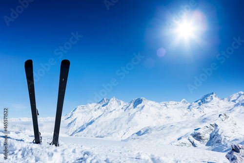 Skiing in the Swiss Alps. Ski, winter season, mountains and ski equipments