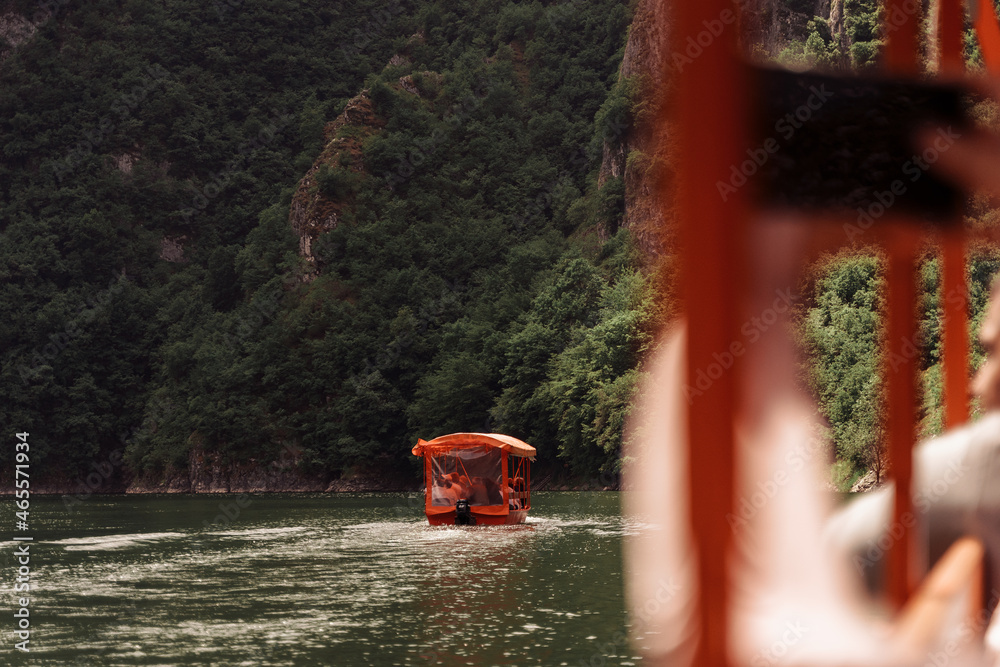 red boat floats on the river in Vietnam red boat floats on the river in Vietnam