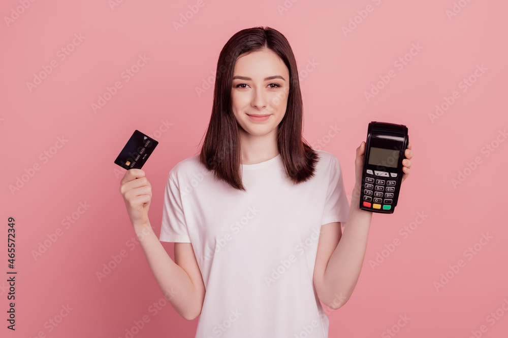 Photo of young pretty girl hold credit card atm terminal cashless pay shop buy isolated over pink color background Photo of young pretty girl hold credit card atm terminal cashless pay shop buy isolated over pink color background