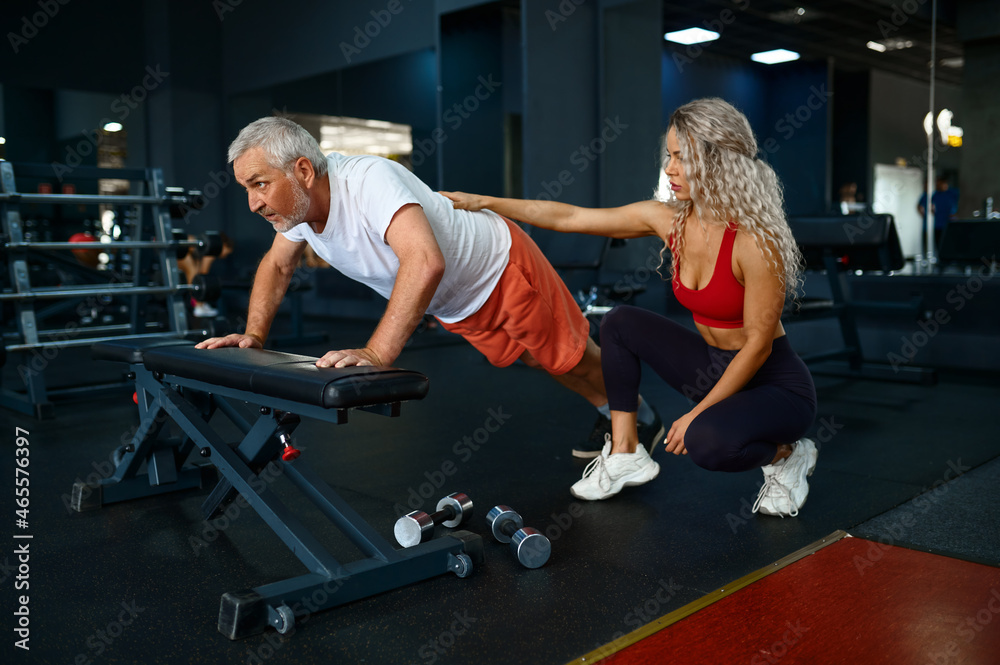 Old man push up exercise on bench female trainer Stock Photo Adobe Stock