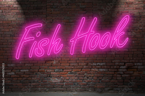 Neon Fish Hook lettering on Brick Wall at night