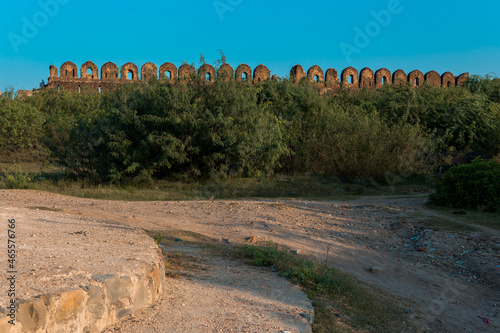 Rohtas Fort wall view surrounded by green bushes